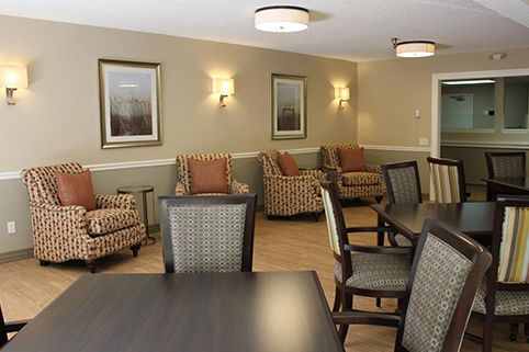 A cozy lounge area featuring comfortable seating and warm lighting.