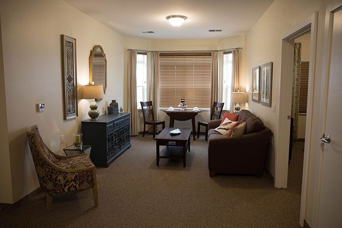 A cozy living room with comfortable seating and elegant decor.