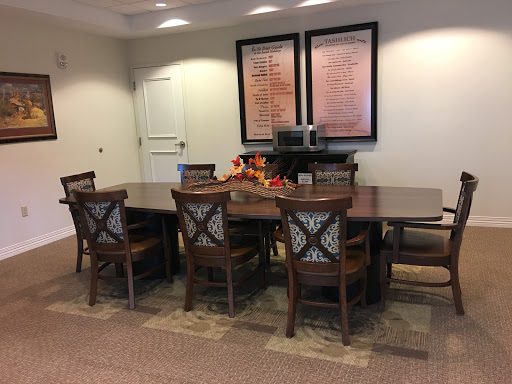 A well-furnished conference room with a large table and comfortable chairs.