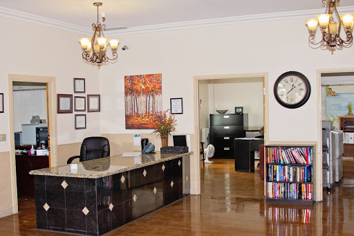 A welcoming office reception area featuring elegant decor and functional workspace.