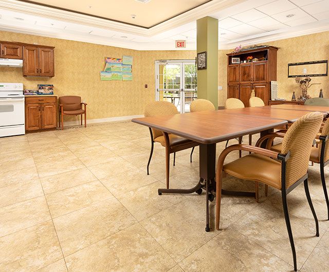 A modern conference room with a large table and chairs.