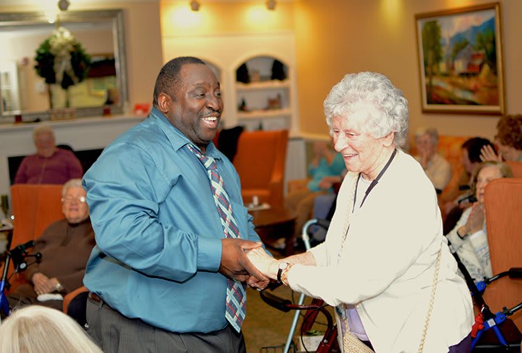 Two people share a joyful moment dancing together.
