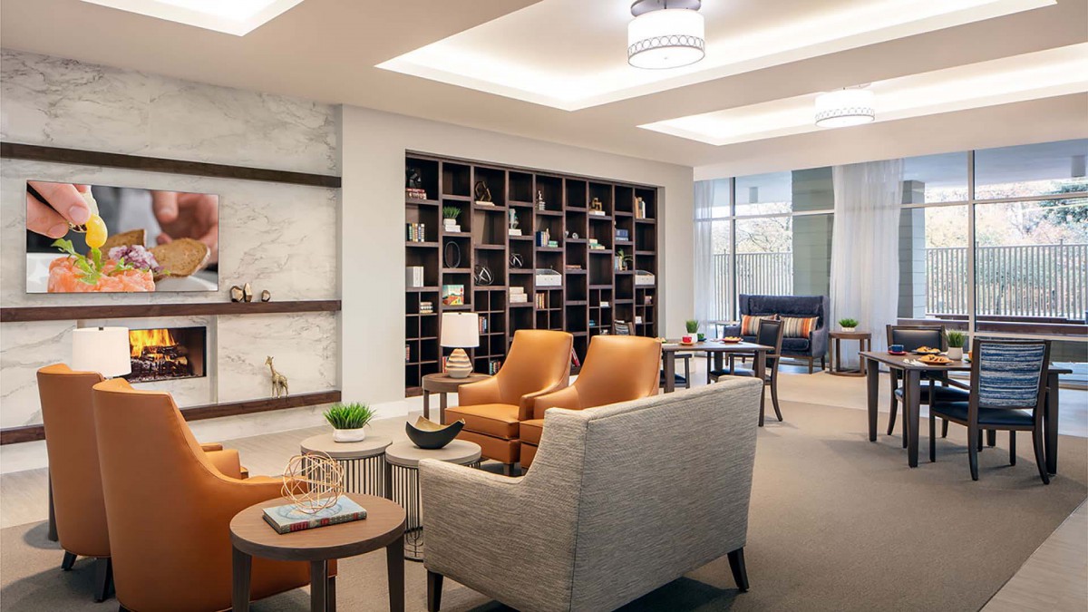 A modern lounge area with stylish furniture and shelves.