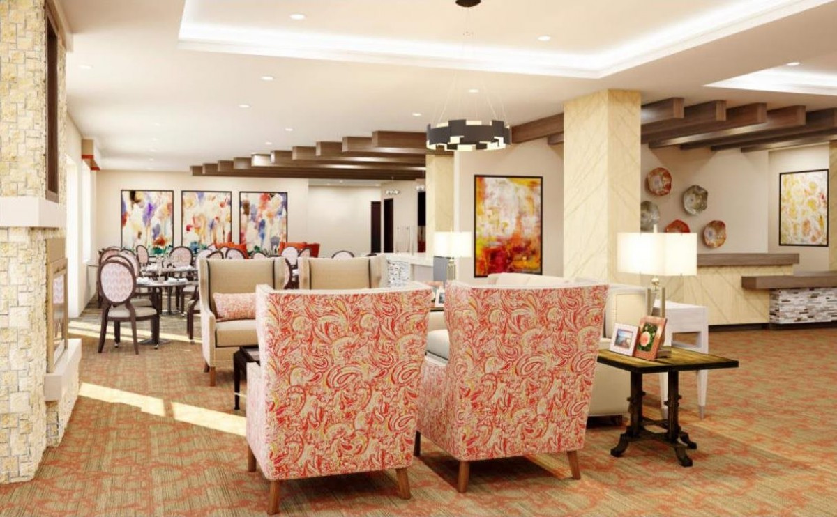 A stylishly decorated living room with patterned chairs and colorful artwork.