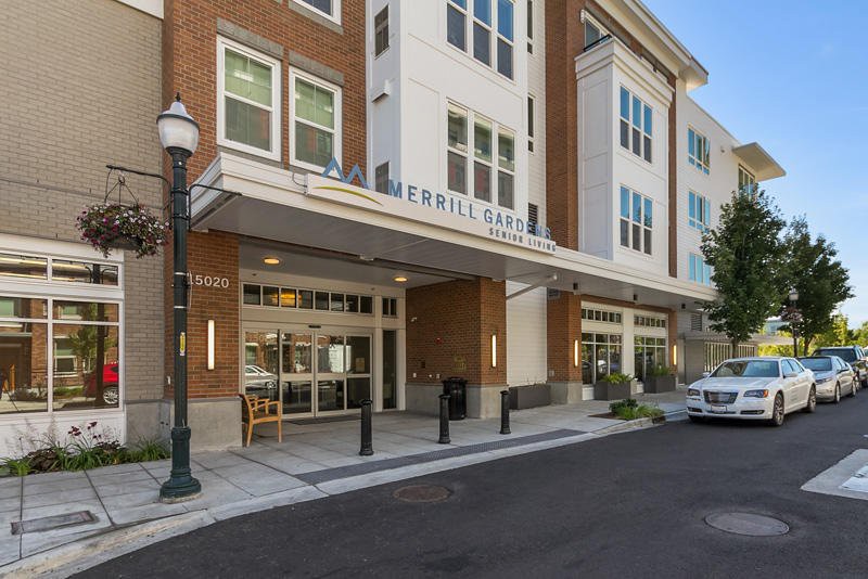 A modern hotel entrance with large windows and a clean, inviting facade.