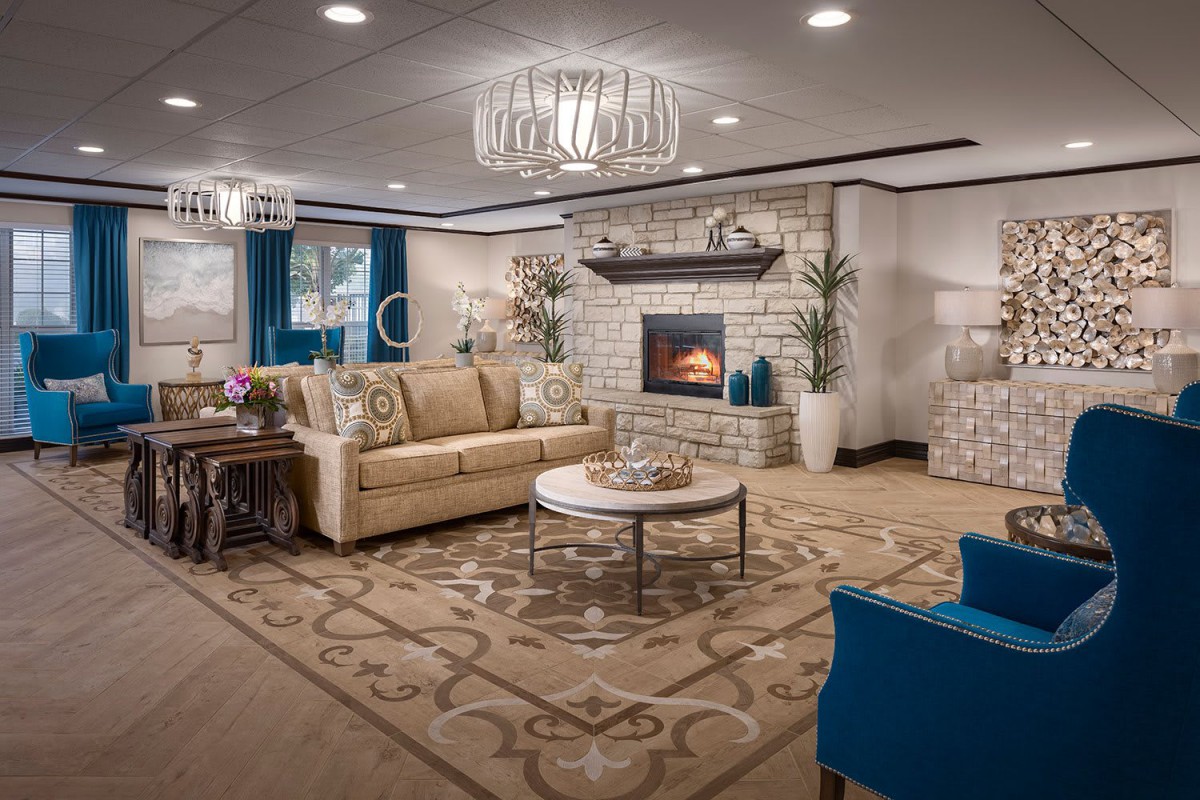 A luxurious living room with elegant furnishings and a cozy fireplace.