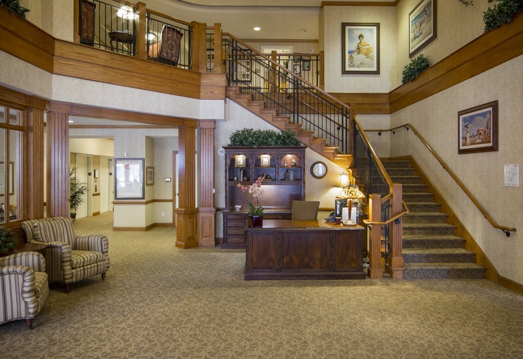 A welcoming lobby area with a reception desk and stairs.