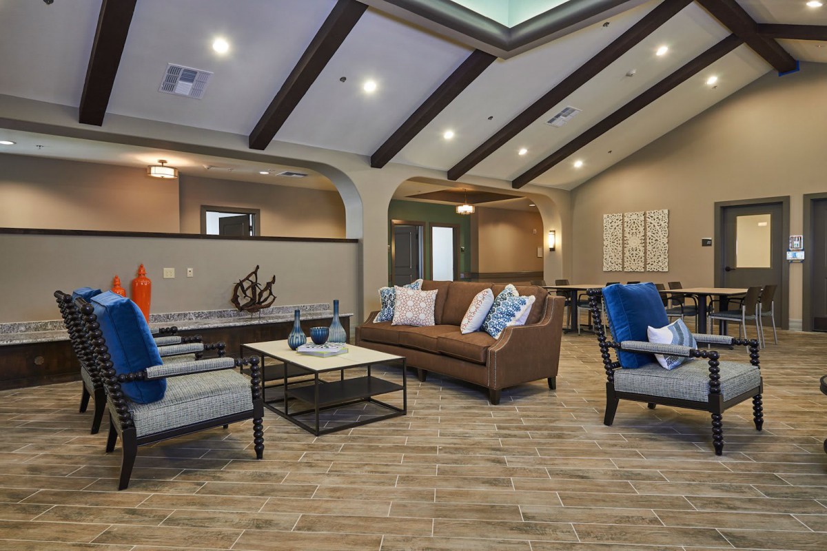 A modern living room with stylish furniture and warm lighting.