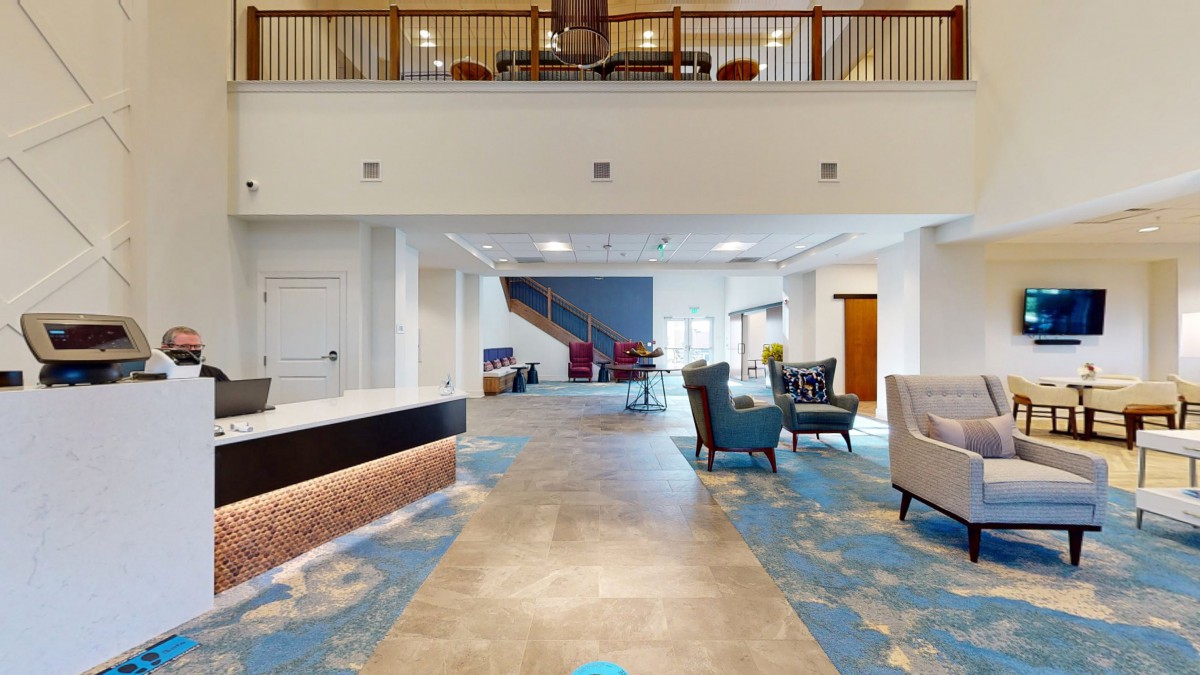A spacious and modern hotel lobby with comfortable seating areas.