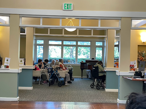A serene gathering in a community activity room, where residents enjoy social interaction.