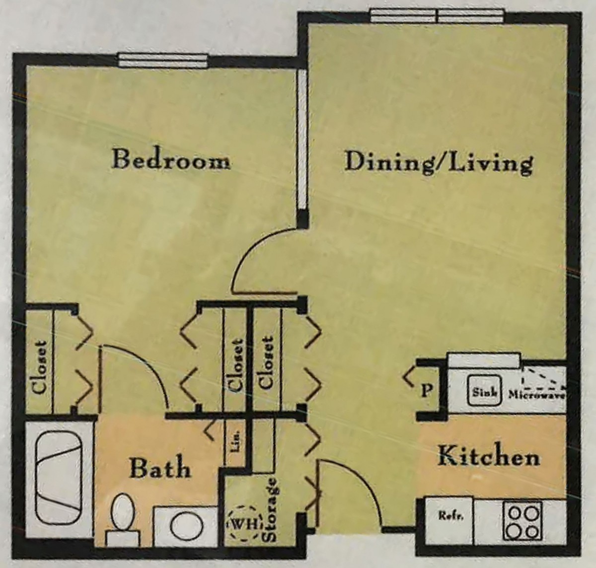 A floor plan layout featuring a one-bedroom apartment with a kitchen, bathroom, and a combined dining and living area.