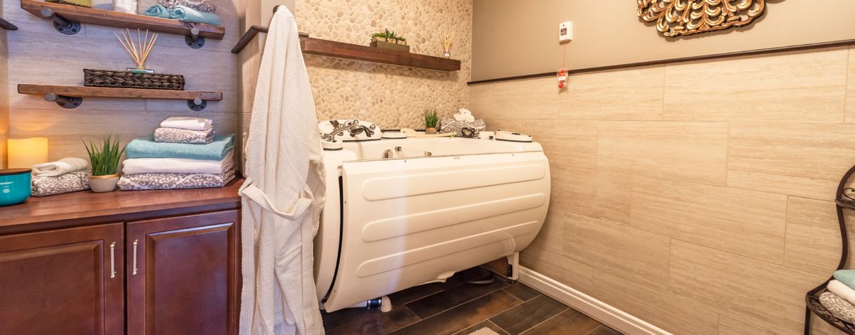 A cozy bathroom featuring a jacuzzi-style bathtub, ideal for relaxation and spa-like experiences.
