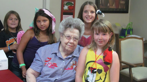 A heartwarming moment shared between a grandmother and her grandchildren.