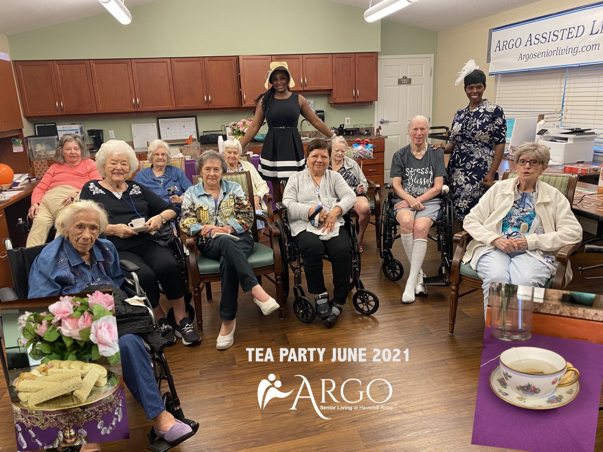 A group of seniors enjoying a tea party at ARCO in June 2023.