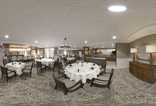 A modern dining area featuring elegantly arranged round tables and stylish chairs.