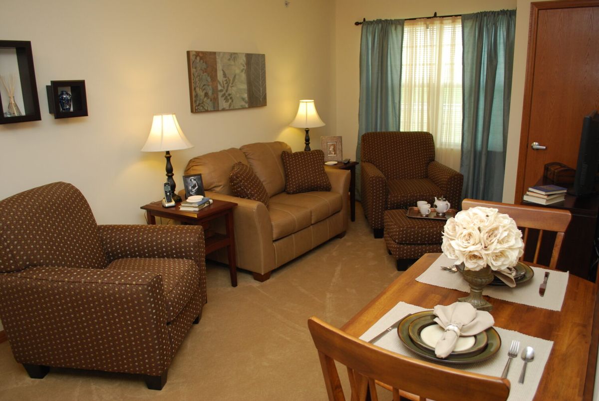 A cozy living room with comfortable seating and elegant decor.