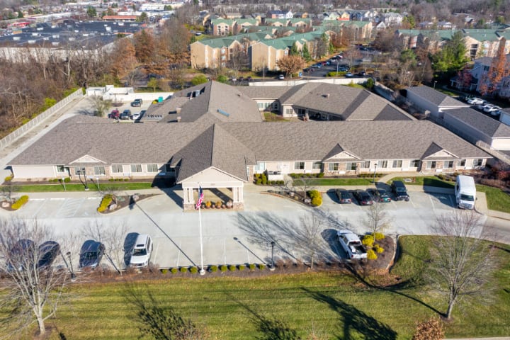 Aerial view of a suburban building with a parking lot.