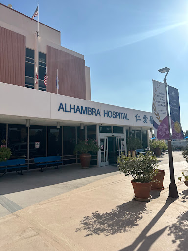 The entrance of Alhamera Hospital, a healthcare facility under clear skies.