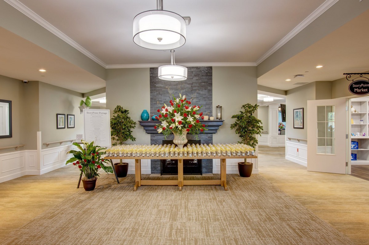 Elegant lobby with floral centerpiece and modern decor.
