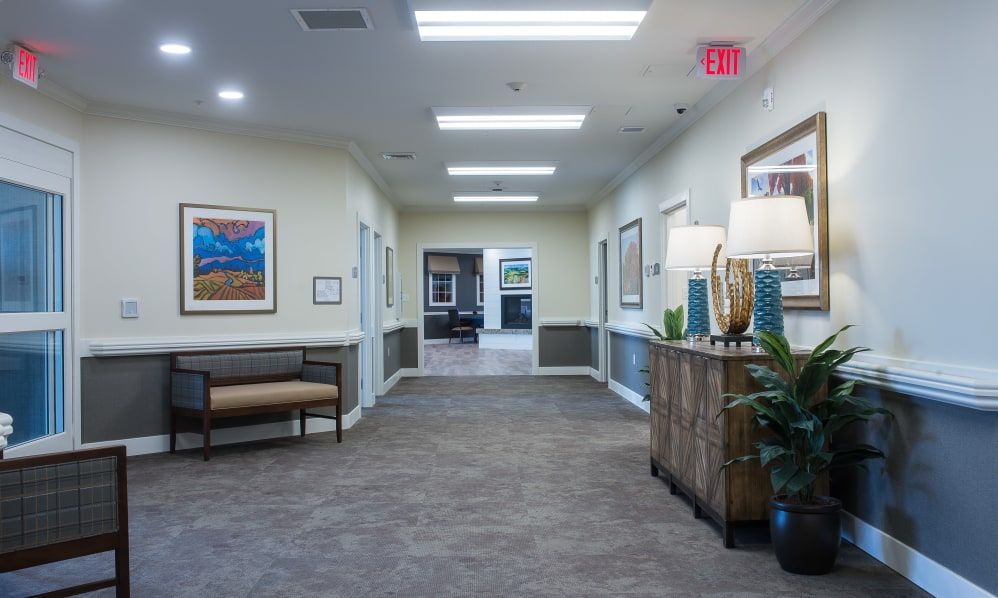 A well-lit hallway with decorative elements and seating.