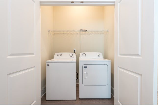 A compact laundry space featuring a washing machine and dryer side by side.