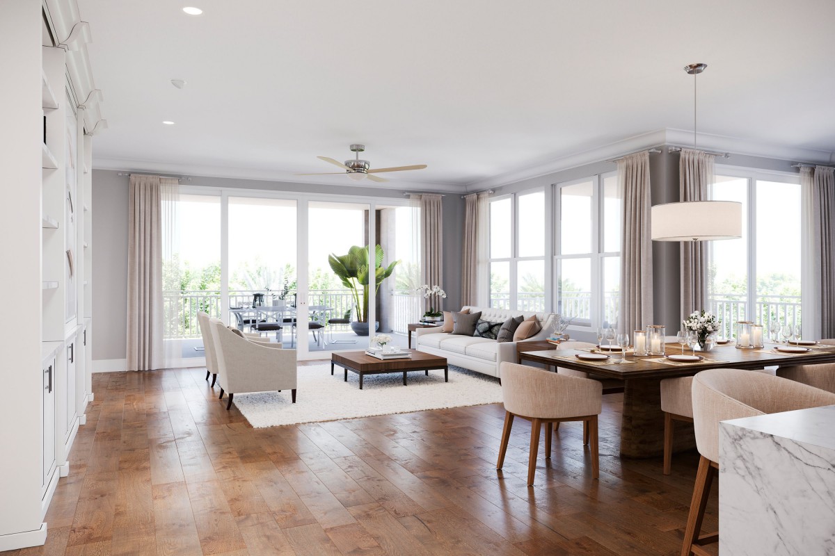 A bright and spacious living room with modern furnishings and large windows allowing plenty of natural light.