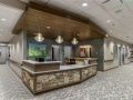 A modern office reception area with stylish lighting and furnishings.