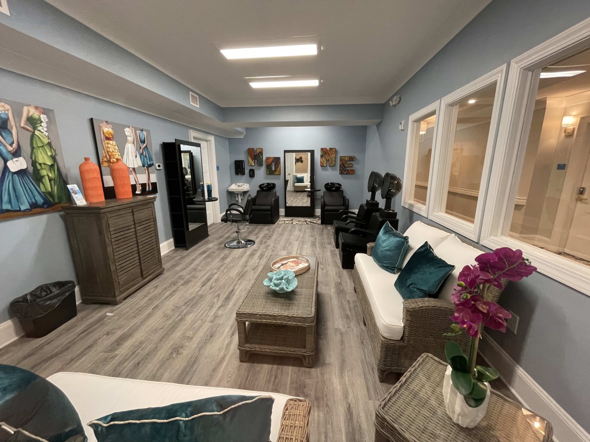 A modern salon interior with comfortable seating and stylish decor.