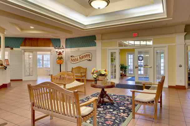 A welcoming lobby with comfortable wooden seating and a stylish decor.