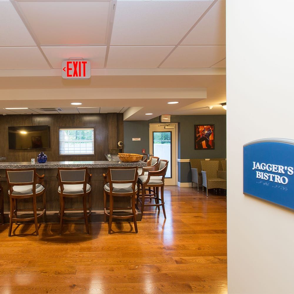 An inviting indoor bistro area with bar seating and a welcoming atmosphere.