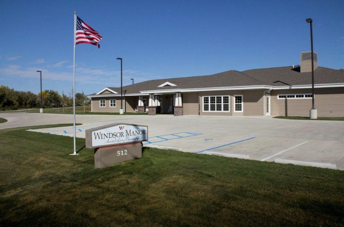 A single-story building with an American flag and a sign reading 'Winnebago Tribe'.