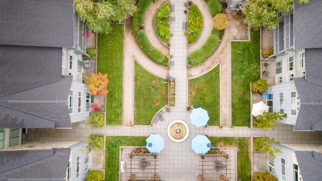 Aerial view of a landscaped courtyard with pathways and greenery.
