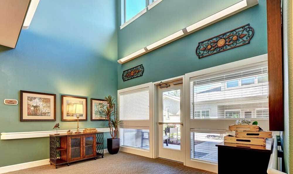 Bright and welcoming lobby area with artwork and natural lighting.