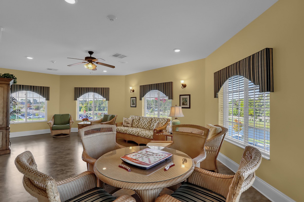 A cozy and well-decorated living room with comfortable seating and elegant decor.