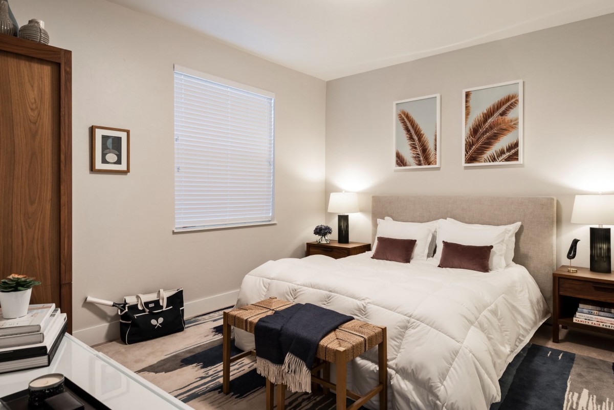 A modern bedroom with stylish decor and cozy ambiance.