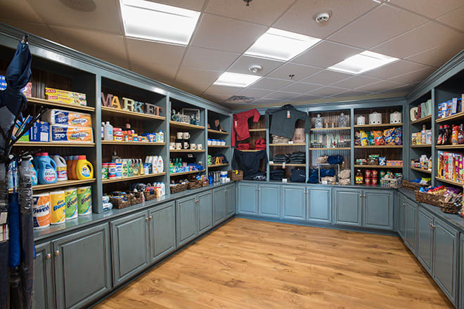 A well-organized retail store with shelves stocked with various products.