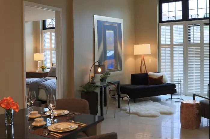 A modern living room with elegant furniture, art, and a cozy ambiance.