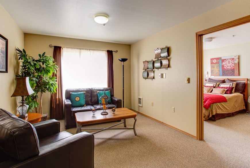 A cozy living room with comfortable seating and inviting decor.