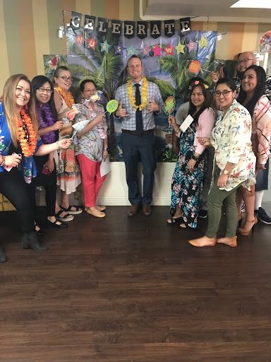 A joyful gathering of colleagues celebrating a special occasion.