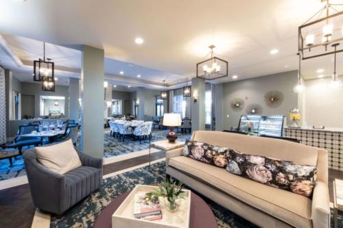A spacious and modern living room with elegant decor and comfortable seating.