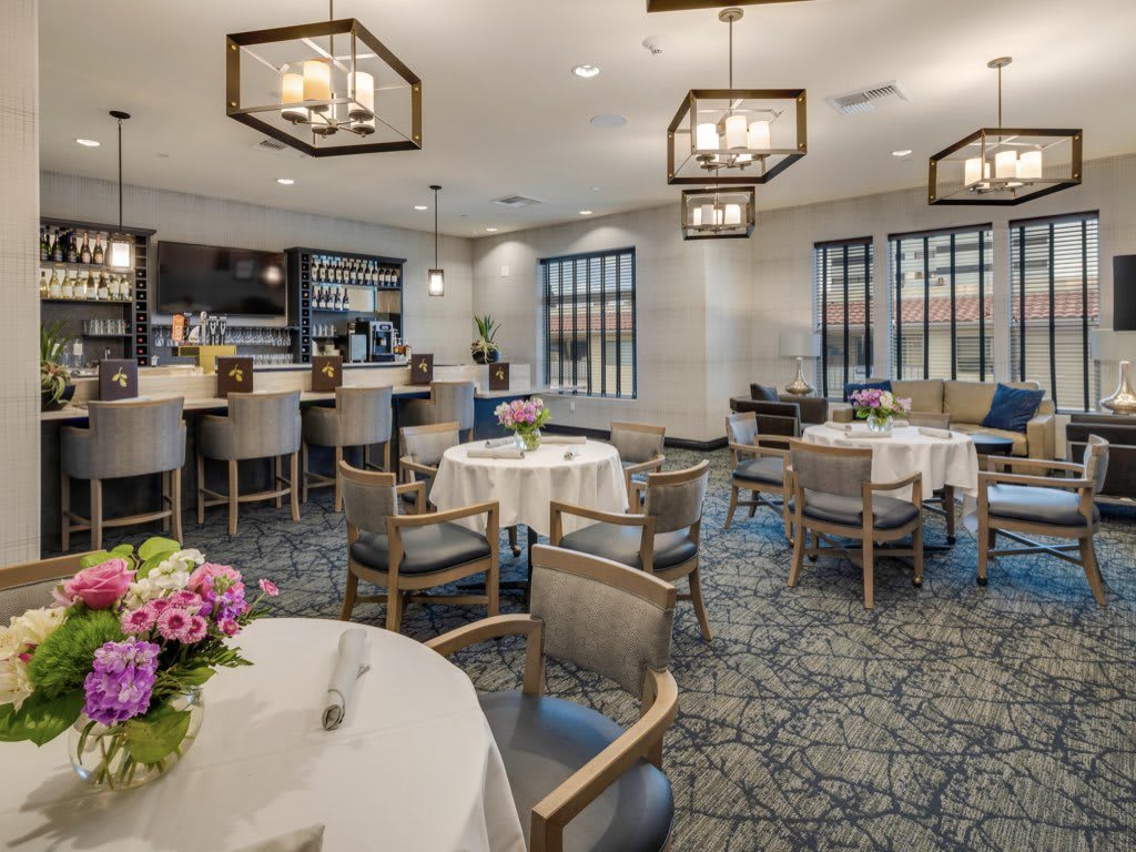 A stylish restaurant interior with elegant seating arrangements and ambient lighting.