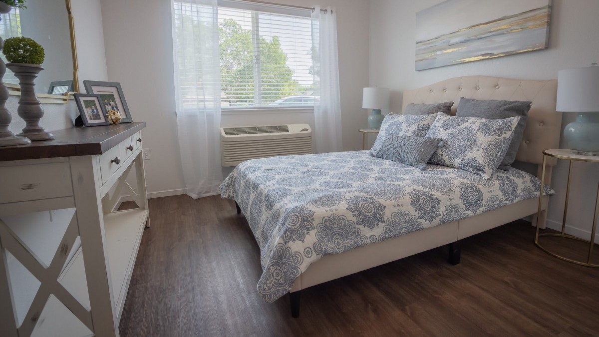A cozy bedroom with modern decor and natural light.