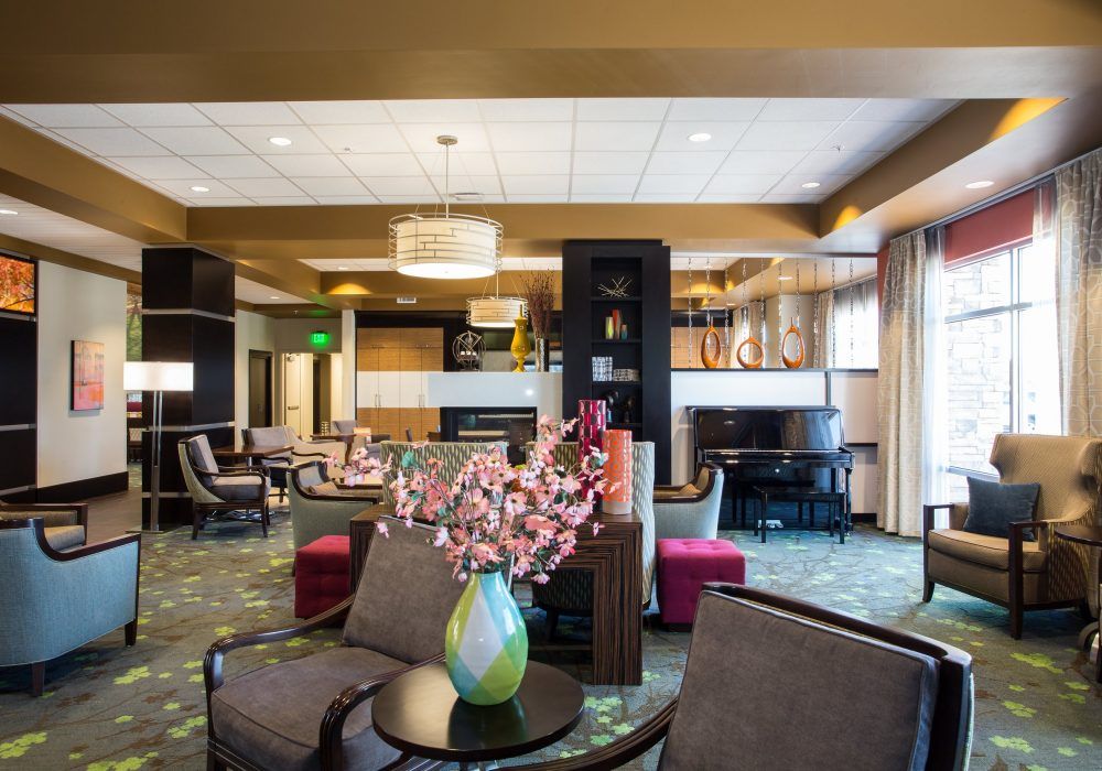 A modern hotel lobby with stylish furniture and decor.
