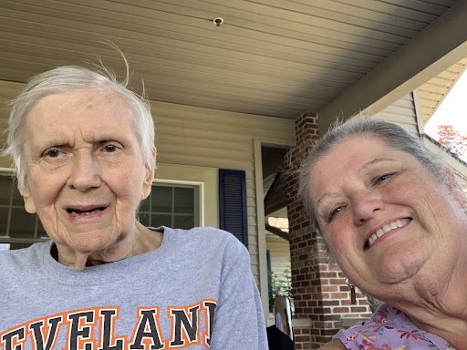 A joyful moment captured in a selfie with smiles and sunshine.