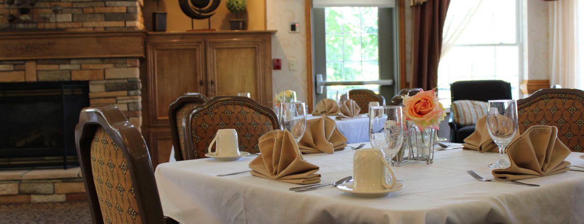 A neatly arranged dining table with elegant settings in a restaurant.
