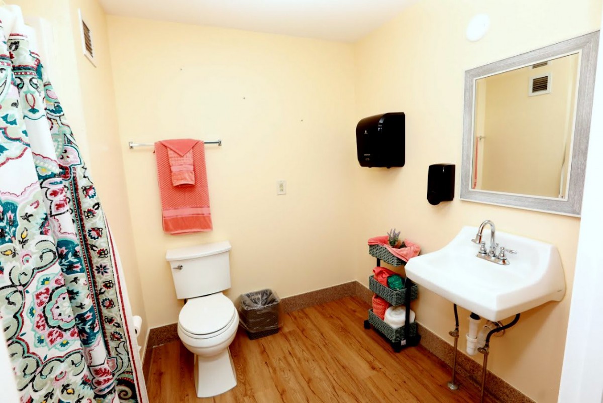 A clean and well-organized bathroom with essential amenities.