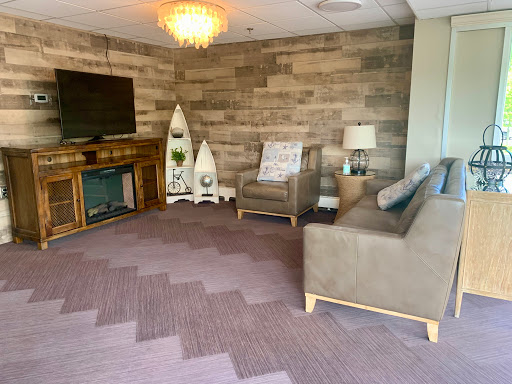 A cozy lounge area featuring a blend of modern and rustic design elements.