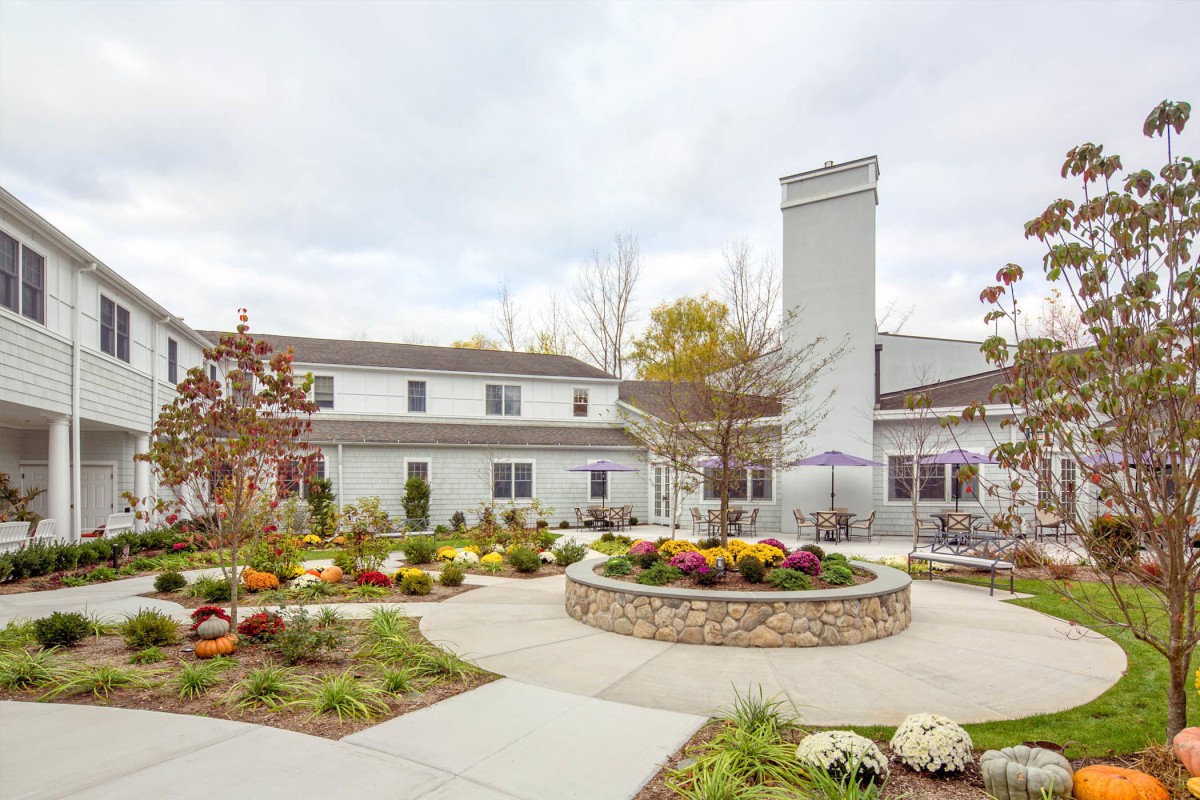 A beautifully landscaped garden in front of a modern building.