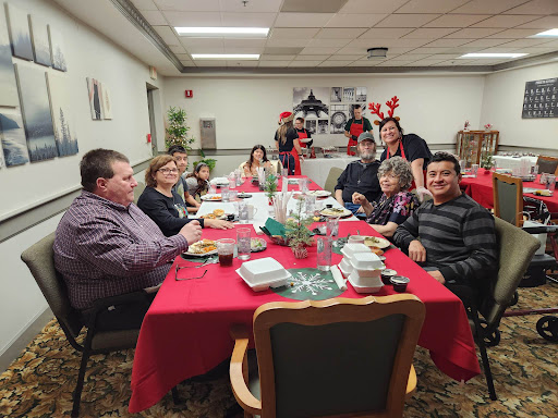 A joyful family gathering at a festive dinner, celebrating the holiday season together.