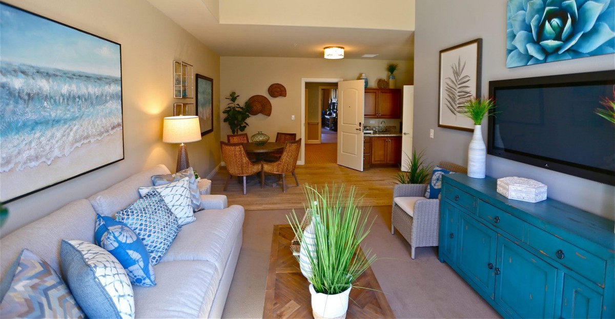 A modern living room with stylish furniture and a cozy dining area.